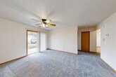 Located at 2228 Gregg Rd in Bellevue, Nebraska, this single-floor, 2-bedroom, 1-bathroom home offers a practical and comfortable layout. The spacious living area is carpeted and features a ceiling fan with light fixture and a sliding glass door that floods the room with natural light and provides access to the outdoors. Warm wood-toned trim and baseboards add a consistent, cohesive finish throughout.

The combined kitchen and dining area is well-appointed with light oak cabinetry offering generous storage, a double sink, a dishwasher, and a range, all set over easy-care luxury vinyl plank flooring. A skylight-style overhead fixture brightens the kitchen, which also includes a window with outdoor views.

The spacious primary bedroom includes its own ceiling fan and ample closet space, while the second bedroom features a large window with neighborhood views and plush carpeting. A dedicated den provides flexible additional space, and four closets throughout ensure excellent storage. The full bathroom is finished with tile flooring and includes a tub/shower combination. A dedicated laundry area and a connected hallway complete the thoughtful, functional floor plan of this well-maintained Bellevue home.