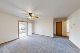 Located at 2228 Gregg Rd in Bellevue, Nebraska, this single-floor, 2-bedroom, 1-bathroom home offers a practical and comfortable layout. The spacious living area is carpeted and features a ceiling fan with light fixture and a sliding glass door that floods the room with natural light and provides access to the outdoors. Warm wood-toned trim and baseboards add a consistent, cohesive finish throughout.

The combined kitchen and dining area is well-appointed with light oak cabinetry offering generous storage, a double sink, a dishwasher, and a range, all set over easy-care luxury vinyl plank flooring. A skylight-style overhead fixture brightens the kitchen, which also includes a window with outdoor views.

The spacious primary bedroom includes its own ceiling fan and ample closet space, while the second bedroom features a large window with neighborhood views and plush carpeting. A dedicated den provides flexible additional space, and four closets throughout ensure excellent storage. The full bathroom is finished with tile flooring and includes a tub/shower combination. A dedicated laundry area and a connected hallway complete the thoughtful, functional floor plan of this well-maintained Bellevue home.