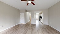 Located at 110 Missouri Ct in Harrisburg, PA, this three-story home offers 3 bedrooms and 3 bathrooms thoughtfully distributed across three floors of comfortable living space. The main living level features an open-concept layout connecting the living room and kitchen. The kitchen is equipped with stainless steel appliances — including a French door refrigerator, electric range, built-in microwave, and dishwasher — complemented by white shaker-style cabinetry, light countertops, and a double-basin sink. Light hardwood-style flooring runs throughout the main level, contributing to a clean, modern aesthetic. The living room is bright and airy, featuring a ceiling fan and access to the exterior. Bedrooms are carpeted for comfort and each include a ceiling fan and closet with built-in shelving. The bathrooms are finished with a tub-shower combo and brushed nickel fixtures. The lower level houses a utility room with washer and dryer hookups and presents an unfinished basement offering flexible potential for storage or future finishing. Two staircases connect the floors efficiently. Neutral tones and consistent finishes throughout give the home a cohesive, move-in ready appearance.