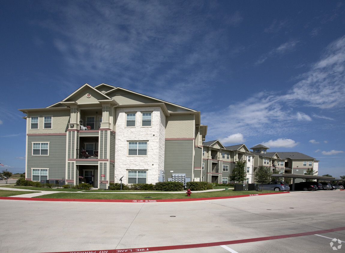 Primary Photo - Bluffs Landing Senior Village Apartments