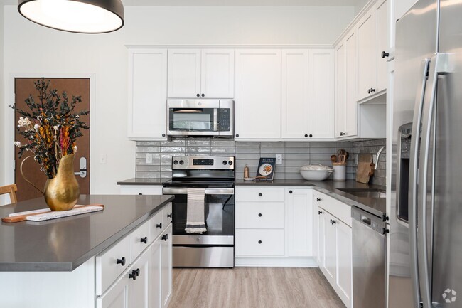 Modern kitchens are designed with sleek finishes and high-end appliances for a polished, functional space. - The Rowan