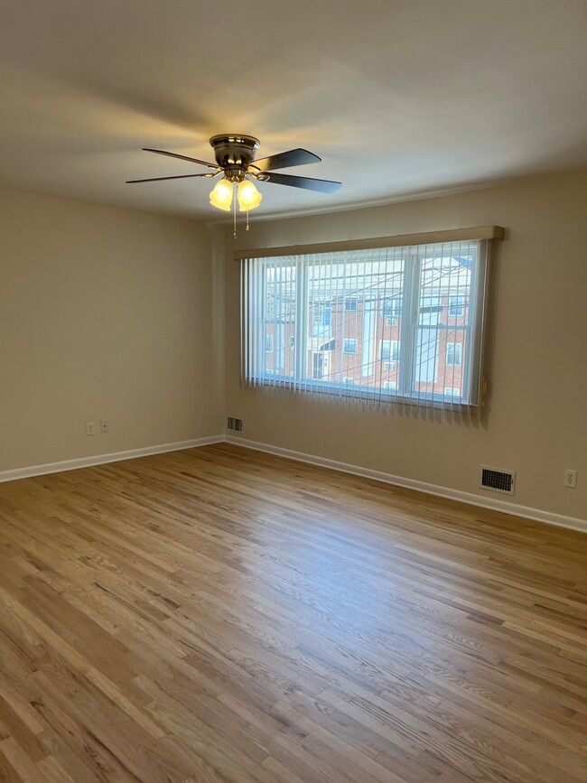 Large living room with new fan/light, freshly refinished hardwood - 1445 Valley Rd