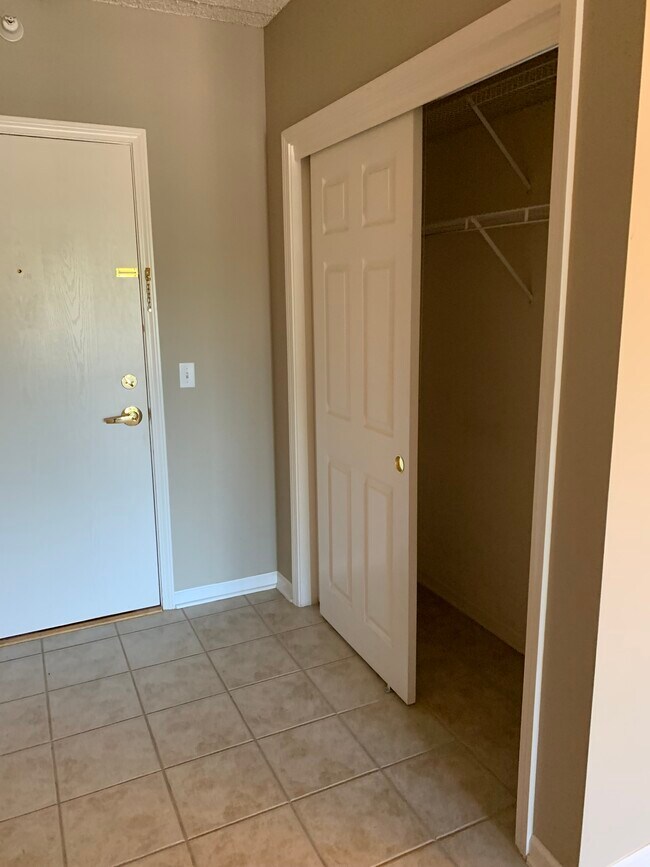 Front foyer with large coat closet. - 5 W Central Rd