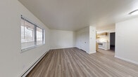 Located at 1854 Garden Ridge Dr in Toledo, Ohio, this one-bedroom, one-bathroom unit offers a well-organized, efficiently designed single-floor layout. The open living and dining area is bright and welcoming, featuring light wood-style vinyl plank flooring, crisp white walls, and a large window fitted with blinds that allows natural light to fill the space. A baseboard heating system runs along the perimeter, ensuring year-round comfort.

The galley-style kitchen is thoughtfully appointed with warm honey-toned wood cabinetry, ample upper and lower storage, light countertops, a double-basin stainless steel sink, and white appliances including an electric range and a full-size refrigerator. The kitchen flows seamlessly into the dining and living areas, creating a cohesive, functional living space.

The bedroom offers a comfortable footprint with its own wood-style flooring, a window with outdoor views, a wall-mounted air conditioning unit, and access to two closets for generous storage. The bathroom is clean and straightforward, featuring a full soaking tub and shower combo with chrome fixtures and crisp white finishes throughout. The overall ambiance of the unit is clean, neutral, and move-in ready.