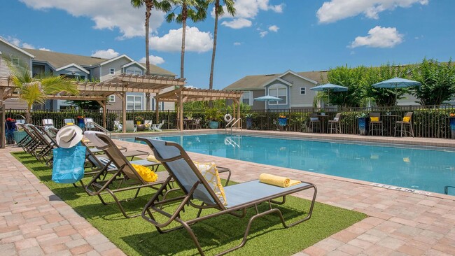 At Ashton Chase, we offer options to enjoy the great outdoors poolside. Catch some rays on our inviting chaise loungers or opt to sip a refreshment seated at one of our high-top tables beneath shady umbrellas. - Ashton Chase