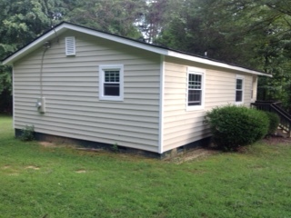 This is a side shot of the house showing off the new windows and siding. - 2680 Ballsville Road