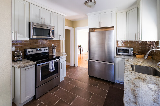 New stainless steel appliances • granite countertops - 304 NE 45th Ave