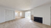 Located at 7939 Coventry Ct in Evansville, Indiana, this single-story unit offers two bedrooms and one bathroom across a well-organized floor plan. The living area is a standout feature, highlighted by a corner fireplace with tile surround and large sliding glass doors that flood the room with natural light and provide outdoor access. Soft carpeting runs throughout the living and bedroom areas, while textured ceilings add a classic touch. Built-in shelving flanks the fireplace wall, offering practical display and storage space. The kitchen features warm wood-toned cabinetry, wood-look flooring, and includes appliances such as a refrigerator, oven, and dishwasher. A window brings in additional natural light, making the space feel open and functional. The primary bedroom is generously sized, offering a louvered bi-fold closet and easy access to the hallway and bathroom. The second bedroom also features carpeting, a natural light window with a view of the outdoors, and its own closet with wood-panel doors. The full bathroom includes a tiled tub-shower combination and wood-look flooring. A dedicated hallway connects all rooms efficiently, with an additional closet for extra storage. This unit provides a comfortable and practical layout suited for everyday living.