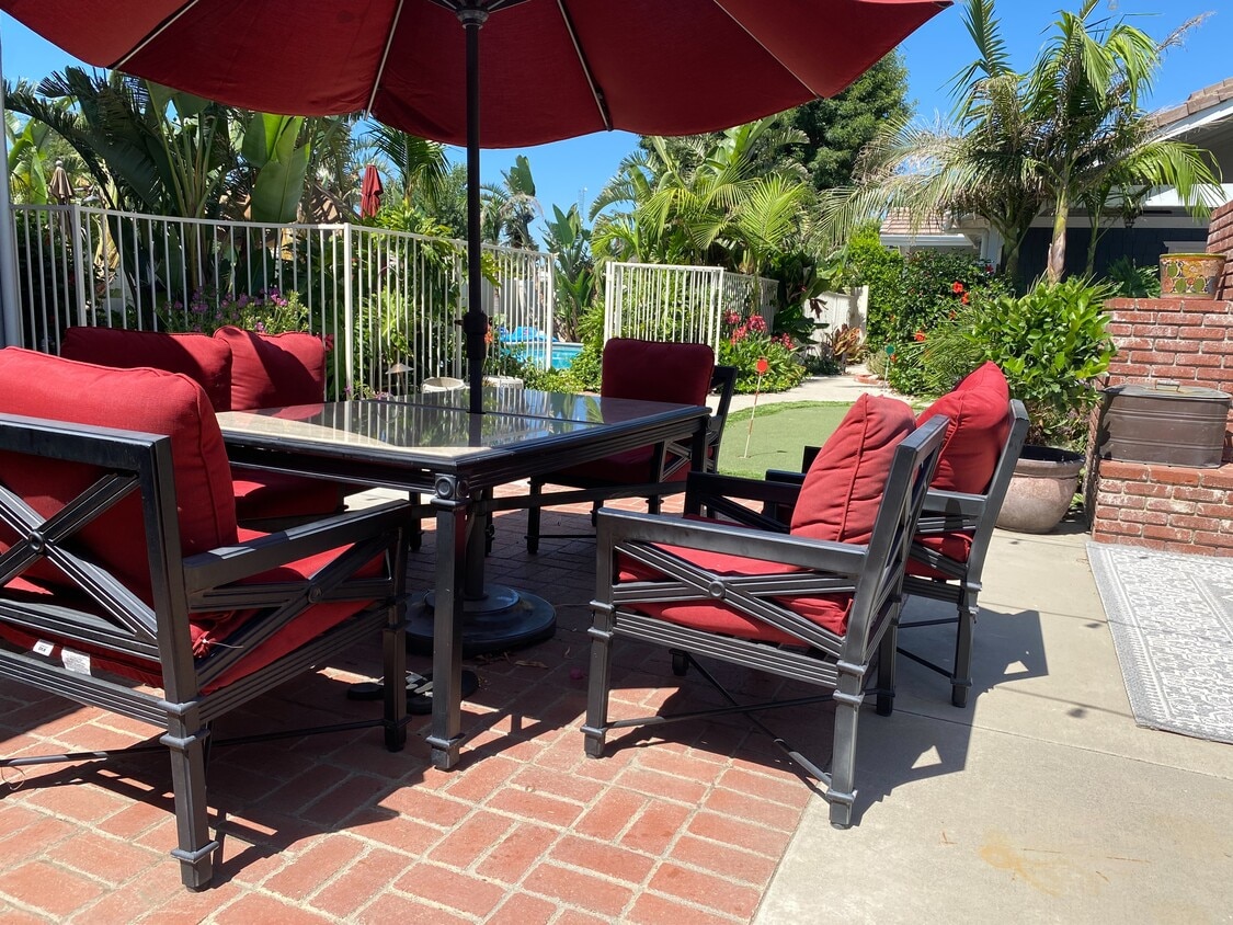 Gather with family and friends for al fresco dining in the inviting backyard setting - 5506 Malachite Ave