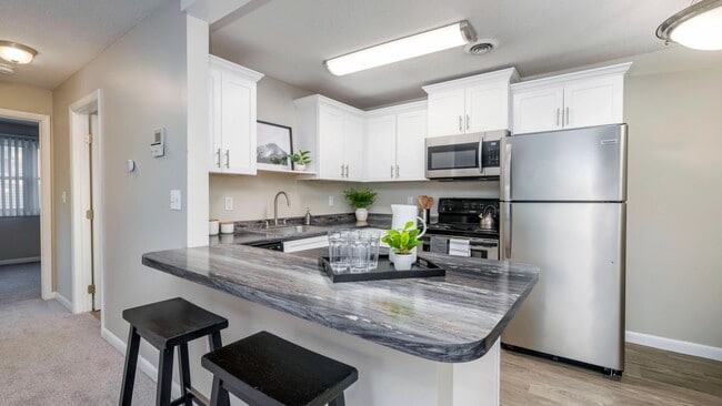 Enjoy the modern allure of our well-appointed kitchens featuring stainless steel appliances, spacious countertops, and ample cabinetry for your convenience. - Welby Park Estates Apartments