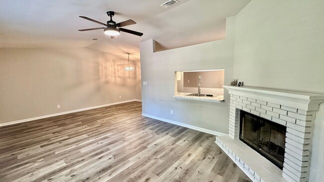 Building Photo - RENOVATED 2/2 w/ Updated Flooring, Paint, Appliances, & Fixtures! Open Floor Plan & Fenced Yard! ...