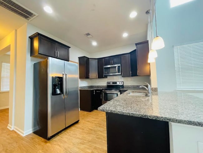 Photo - Spacious 4BR/3.5BA Townhome Minutes from Campus – Perfect for Roommates or Families