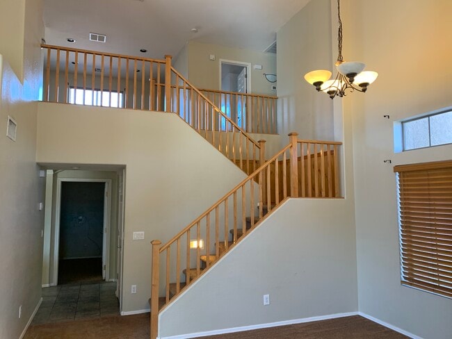 Spacious 4-bedroom, 2-bath home with soaring ceilings, gourmet kitchen, and a heated self-cleaning p - 16426 N 152nd Ln