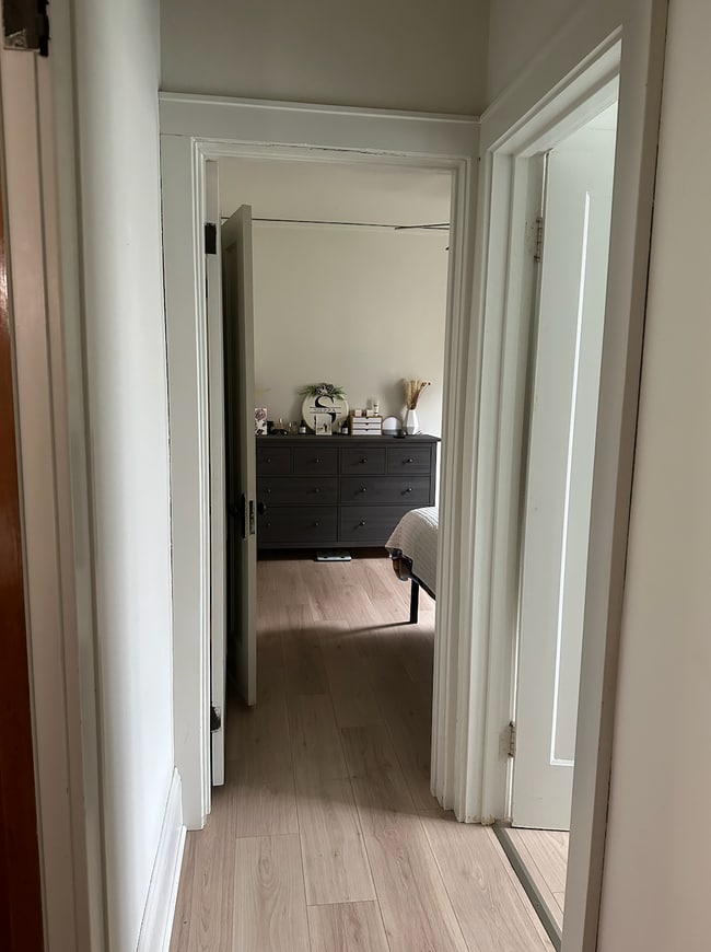 hallway connecting two bedrooms, kitchen, and bathroom. - 1552 S 58th St