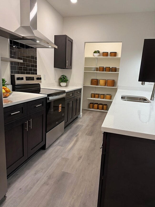 Kitchen w/ Quartz Island & Counters - Point Gardens Apartments