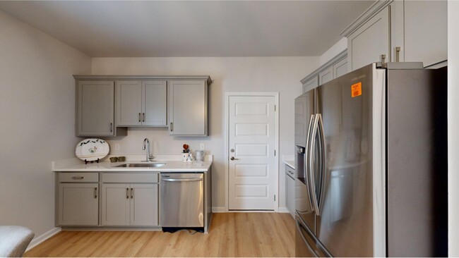 This kitchen showcases an elegant countertop for casual dining and new stainless steel appliances - 15747 Ruthie Lynn Dr