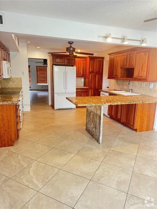 Building Photo - 3111 Coral Springs Dr