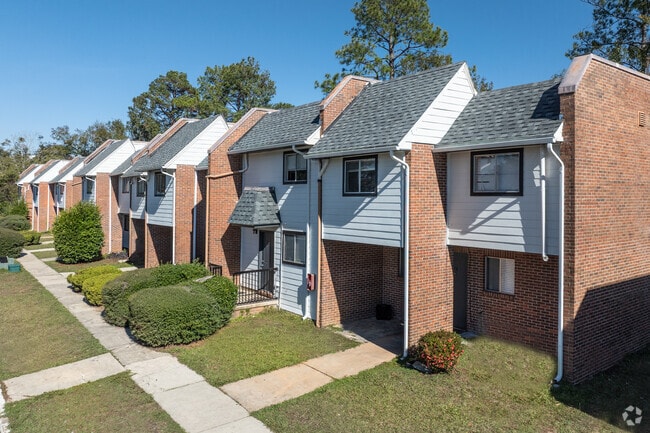 Building Photo - The Residences at Whispering Pines