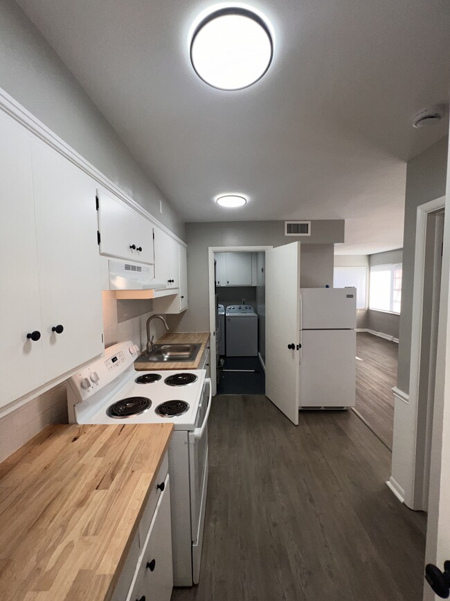 Kitchen to laundry - Cypress West Fairlawn Apartments