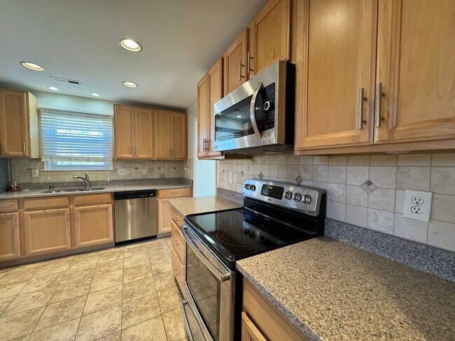Building Photo - Welcome to this charming bungalow-style ho...