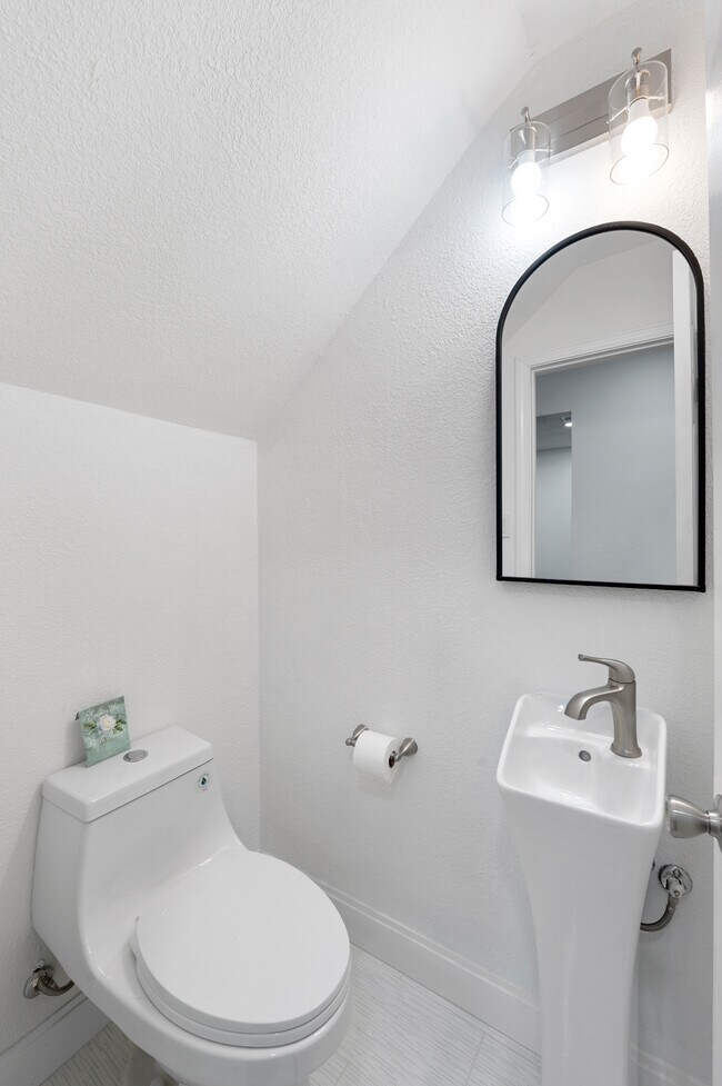 Convenient half bath located downstairs. Perfect for guests! - 1501 Stallings Dr