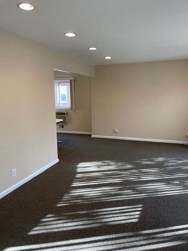Large living room with high-hat lighting - 24303 72nd Ave
