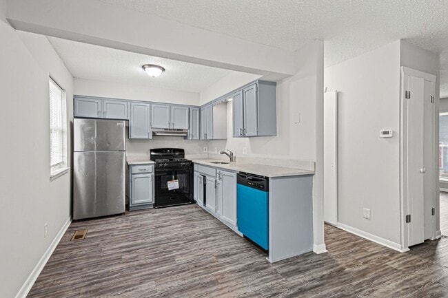 Building Photo - Summer Special! Updated 3BR Townhome with Basement + $250 Off First Month’s Rent
