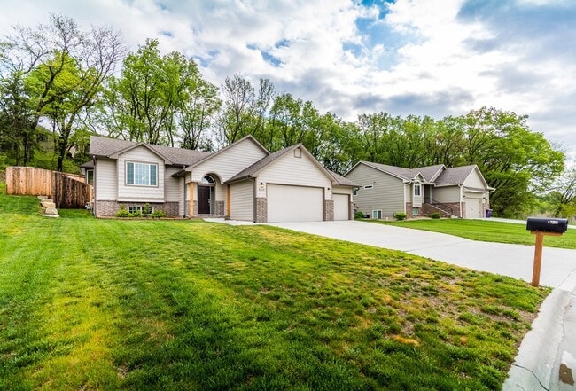 Building Photo - Fenced-in Yard + 3-Car Garage + Finished B...
