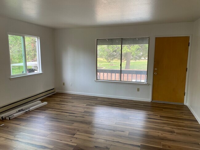 Living room, brand new LVP flooring throughout. - 20695 Parkside Ln