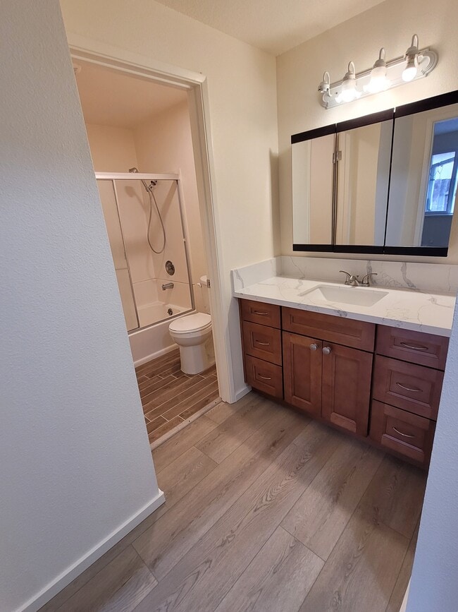 Separate vanity space from shower/toilet area. - 1045 S Jasper St