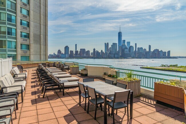 Elevate your gatherings on a rooftop deck that offers stunning skyline vistas - Newport Rentals