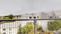 Located at 535 Glenrock Ave in the heart of Los Angeles, this modern 3-bedroom, 2-bathroom unit offers a thoughtfully designed single-floor layout with a clean, minimalist aesthetic throughout. Light wood laminate flooring flows seamlessly across the entire space, creating a warm and cohesive feel.

The open-concept living and kitchen area serves as the heart of the unit. The kitchen is outfitted with light wood cabinetry, stainless steel appliances including a full-size refrigerator and oven, and a tiled backsplash, complemented by a compact dining area. The adjacent living space provides a comfortable and functional gathering area.

Each of the three bedrooms features tall windows that invite abundant natural light and offer views of the surrounding treetops and Los Angeles neighborhood. The primary bedroom includes built-in shelving, a dedicated desk workspace, and a full-length mirrored sliding closet door, maximizing both storage and utility.

The two bathrooms are finished in a contemporary style. One features terrazzo-style flooring, a wall-mounted toilet, a floating wood vanity with a vessel sink, and an illuminated mirrored medicine cabinet. The second bathroom includes a deep soaking tub with vertically tiled surround walls. A private outdoor balcony provides views of the surrounding neighborhood and lush greenery below.