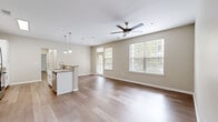 Located at 120 Cinema Dr in Hendersonville, Tennessee, this single-story residence offers a well-designed, open-concept floor plan filled with natural light. The main living area is spacious and airy, featuring light hardwood flooring, neutral warm-toned walls, ceiling fans, and multiple windows with views of the surrounding greenery.

The kitchen is a functional centerpiece of the home, equipped with white shaker-style cabinetry, granite countertops, a subway tile backsplash, and a full suite of stainless steel appliances including a refrigerator, range, microwave, and dishwasher. A kitchen island with a built-in sink and pendant lighting above doubles as a breakfast bar, seamlessly connecting the kitchen to the living space.

The bedrooms are generously sized, with ceiling fans and an abundance of natural light. Some bedrooms feature hardwood flooring, while others are finished with plush neutral carpet, offering comfort and versatility. Closet access is well-integrated into the bedroom layouts.

The bathrooms are clean and well-appointed, featuring white cabinetry with brushed nickel hardware, a wide vanity mirror, and a tiled tub-shower combination. The overall aesthetic throughout the home is cohesive, modern, and move-in ready, with a consistent neutral palette that suits a variety of interior styles.