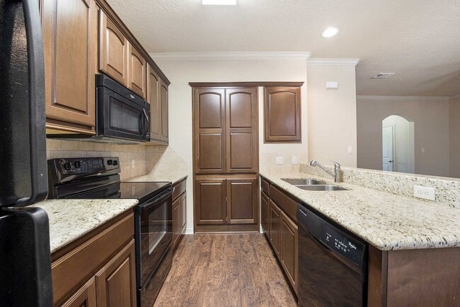 Building Photo - AUGUST PRE-LEASE Spacious 3 Bed, 3.5 Bath Condo with Fenced Backyard