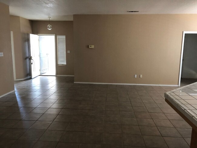 Building Photo - Coming Soon: Spacious 3 Bedroom, 2 Bath Tevis Ranch Home with Fireplace, Covered Patio & 2-Car Ga...