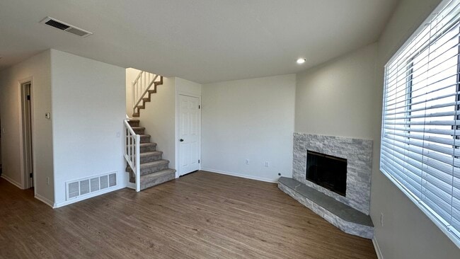Living room with gas fireplace and deep storage/coat closet. - 939 Sapphire St