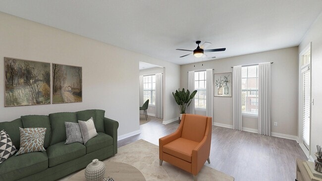 Newly Renovated Living Room with Hardwood-Style Flooring - Double Creek Flats Apartments