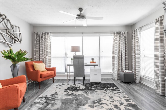 Living Area with Large Windows - The Pointe at Canyon Ridge Apartments