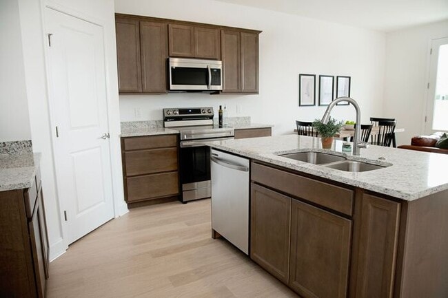Building Photo - $1,000 MOVE-IN CREDIT! Stunning 3-Bed, 2.5-Bath Townhome at The Lily at Clover Ridge