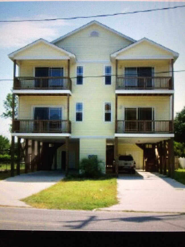 Front of 2-story raised beach house - 126 Woodland Dr