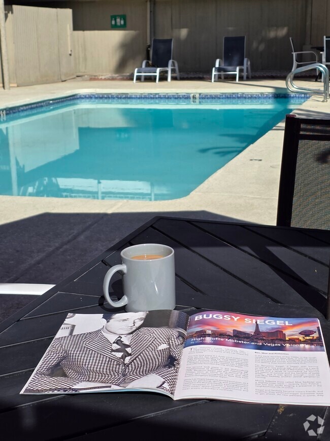 Poolside morning coffee and a good read - Studio 629