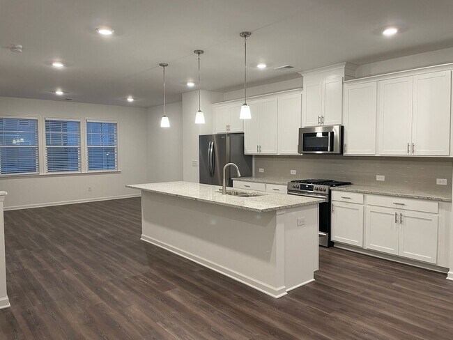 Building Photo - WOW! 4 bedroom, 3.5 bathroom townhome in T...