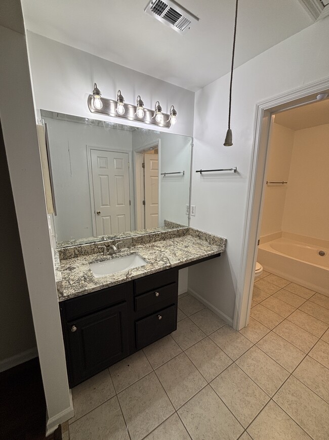 master bath tub and separate shower - 1647 Dexter Ln