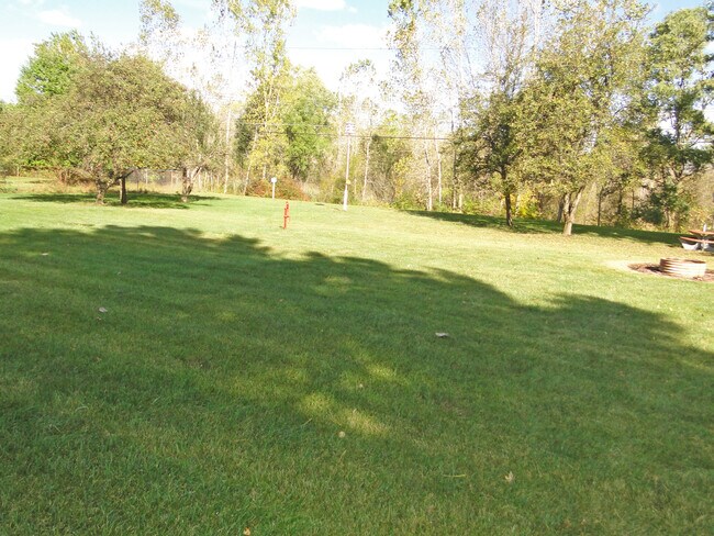 Building Photo - WELCOMING TRI-LEVEL HOME ON OVER AN ACRE O...