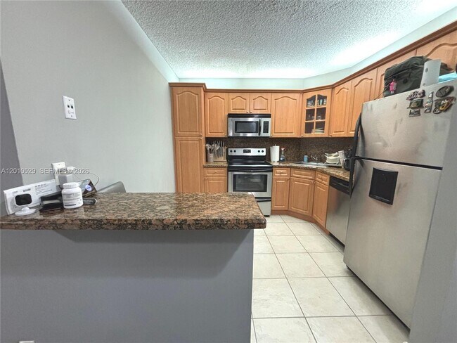 Foto del edificio - 3859 Coral Tree Cir