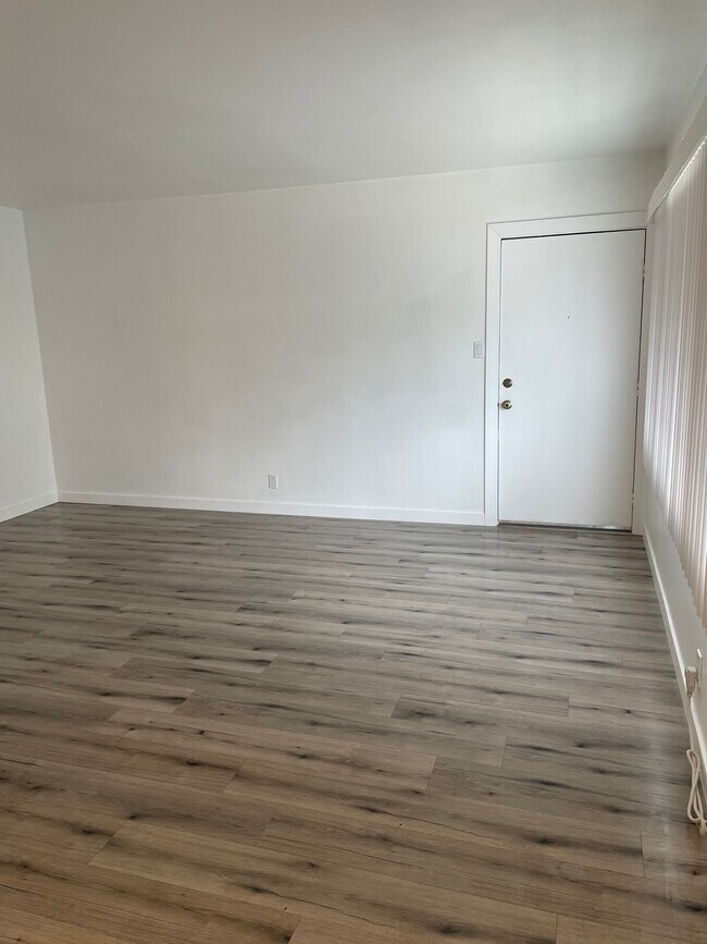 Living room w/ Entrance door - 12329 Oxnard St