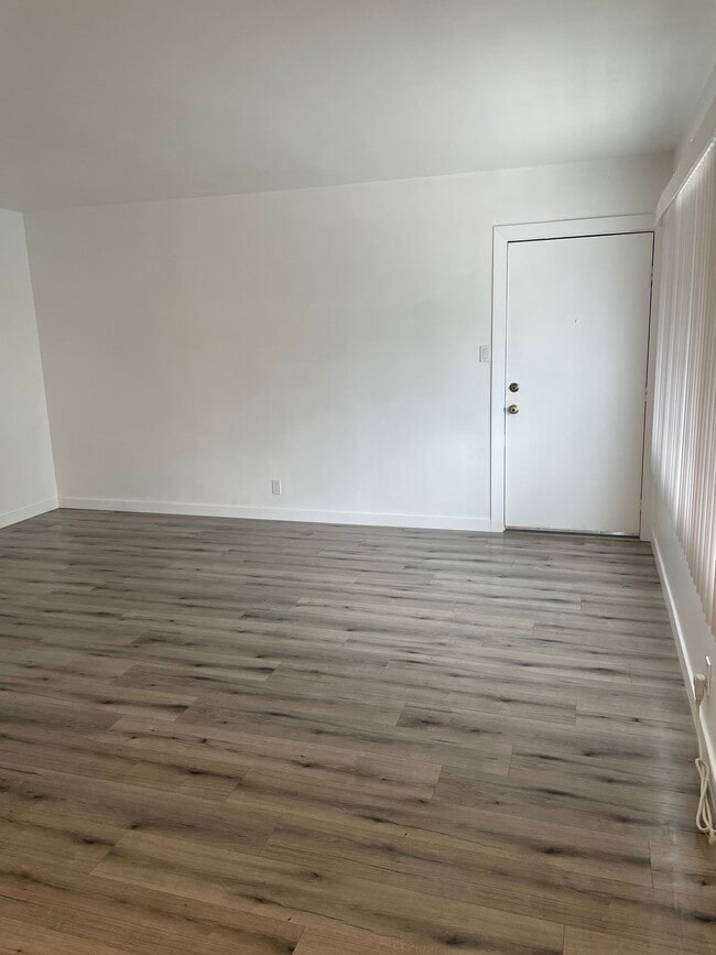 Living room w/ Entrance door - 12329 Oxnard St