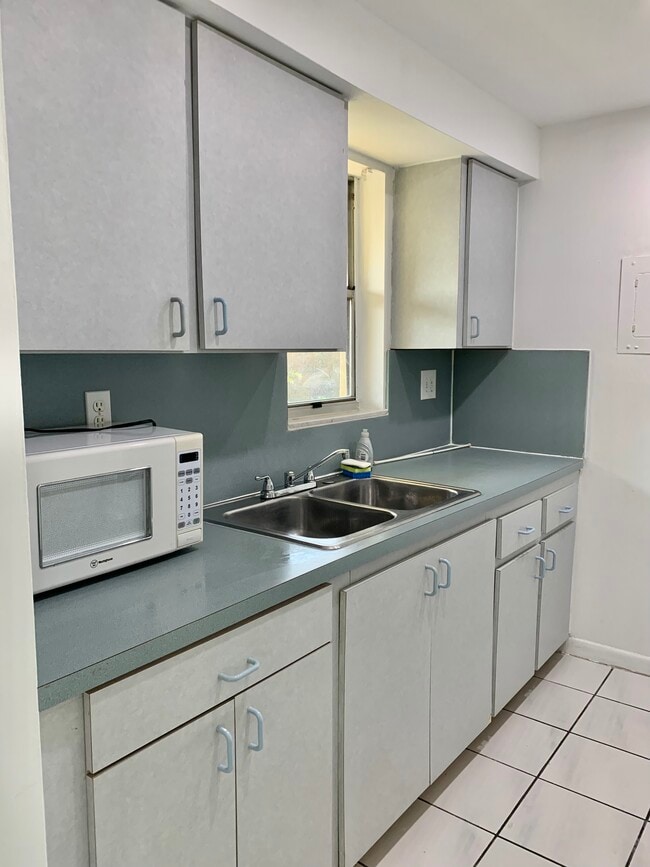Kitchen with Stove and Large Refrigerator - 2690 SW 22nd Ave