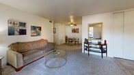 Located at 2610 Deloak Dr in Saint Louis, MO, this single-floor unit offers a functional and comfortable layout across three bedrooms, one bathroom, a living room, and a kitchen. The living room is a welcoming space featuring neutral-toned carpet, a ceiling fan, and a sliding glass door that opens to a private balcony with outdoor views, filling the room with natural light. The kitchen is efficiently designed with warm oak cabinetry, ample upper and lower storage, a tiled floor, and white appliances including an electric range, dishwasher, and refrigerator. The primary bedroom is a well-proportioned retreat with plush carpet and room for a full furniture arrangement. The two additional bedrooms are cozy and carpeted, each with a window allowing natural light, making them suitable as sleeping quarters or a home office. A built-in sliding-door closet is featured in one of the bedrooms for added storage. The full bathroom is clean and simply appointed, complete with a tub-shower combination. Throughout the unit, neutral walls and carpeted floors create a consistent, understated aesthetic. A dedicated closet provides additional storage to complement the overall layout.