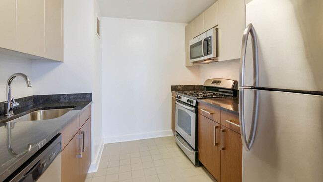 Kitchen with Dishwasher and Stainless Steel Appliances - The Brooklyner